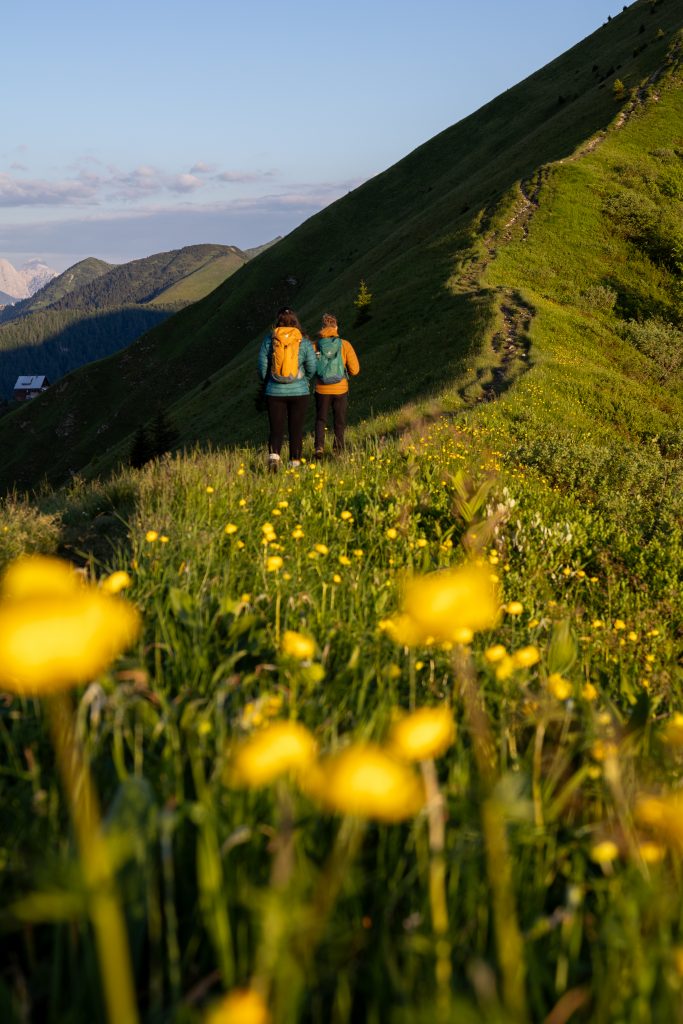 Two people hike along golica ridge
